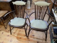 Pair stained wood occasional armchairs.