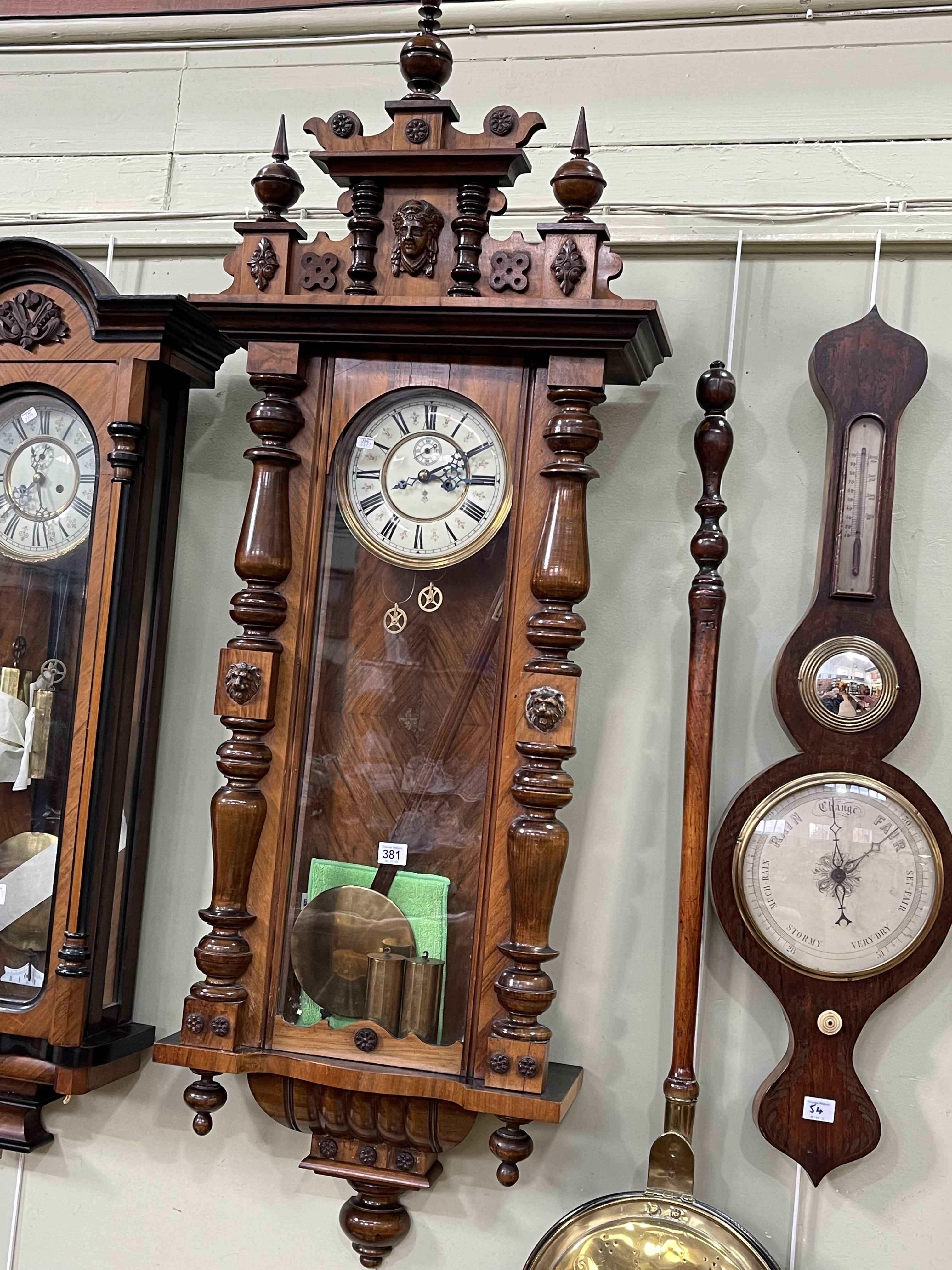 Gustav Becker walnut double weight Vienna style wall clock having initialled enamelled dial, 140cm.