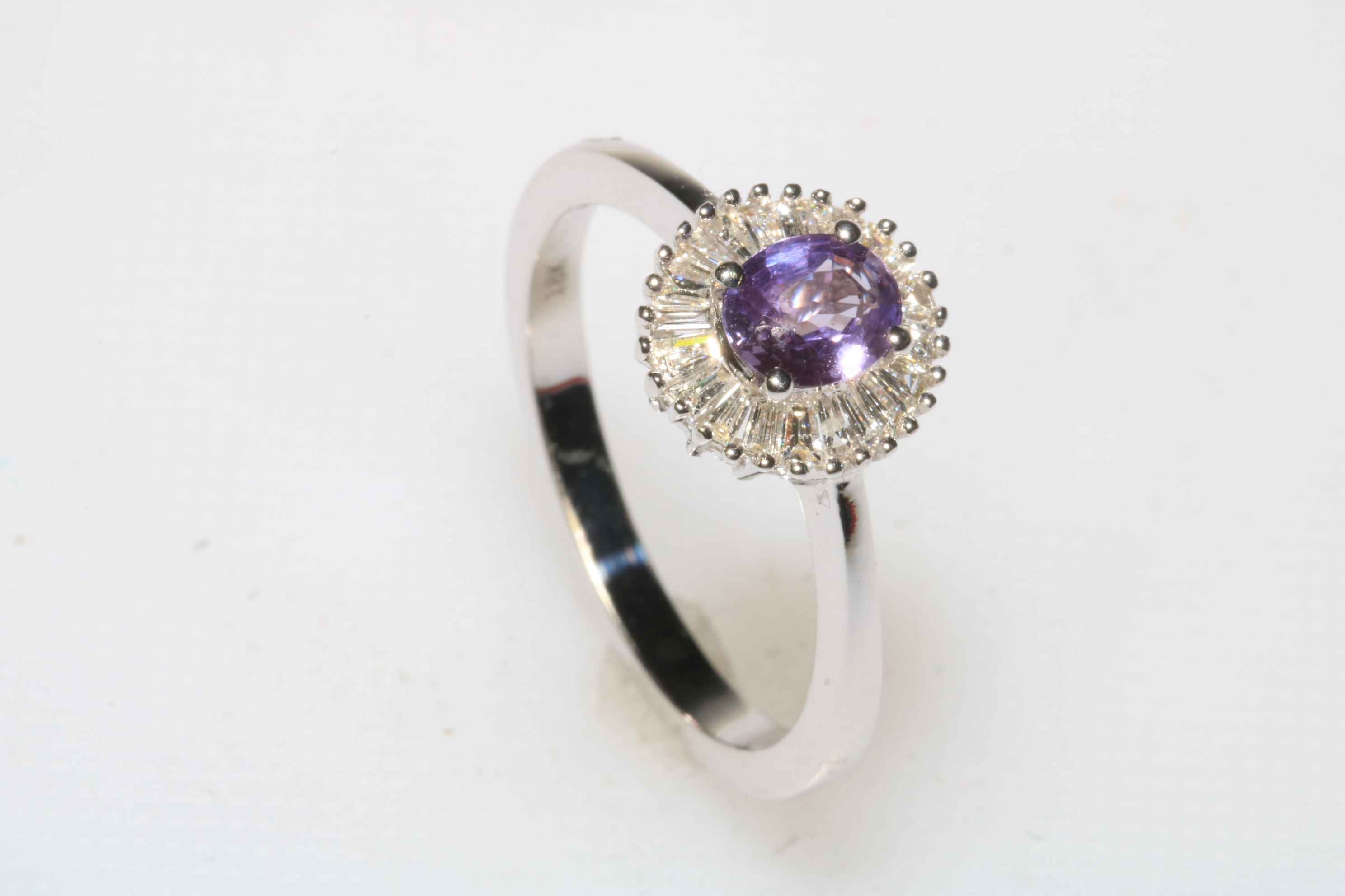 Purple sapphire and diamond 18 carat white gold ring, size R, with certificate.