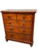 Victorian mahogany chest of two short above three long drawers on turned legs, 116cm by 105.