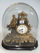 Continental gilt metal mantel clock under glass dome.