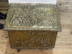 Brass heavily embossed with classical scenes slope front log box.