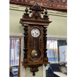 Victorian walnut Vienna style pendulum wall clock having enamelled dial by Fattorini & Sons,