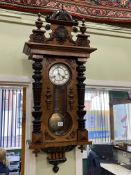 Victorian walnut Vienna style pendulum wall clock having enamelled dial by Fattorini & Sons,