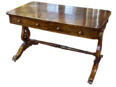 Victorian walnut two drawer library table raised on lyre ends to four scrolled legs,