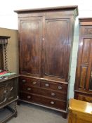 Georgian mahogany linen press having two panelled doors above two short and two long drawers,