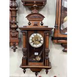 Small Victorian walnut and ebonised pendulum wall clock having enamelled and brass dial, 72cm.