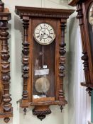 Victorian walnut double weight Vienna style wall clock having enamelled dial, 106cm.