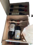 Five bottles of red wine including Chateau Pipeau Saint Emilion.