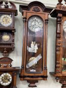 Victorian walnut and ebonised double weight Vienna style wall clock having enamelled dial, 108cm.