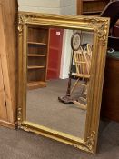 Rectangular gilt framed bevelled wall mirror, 120cm by 89.5cm.