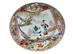 Chinese polychrome plate decorated with ladies in landscape and famille rose border.