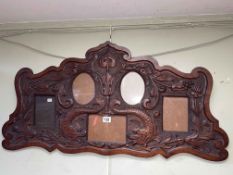 Late Victorian carved mahogany frame of five inset photo frames.