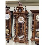 Victorian walnut Vienna style pendulum wall clock having enamelled and engraved brass dial,