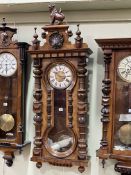 Victorian walnut Vienna style pendulum wall clock having enamelled and engraved brass dial,