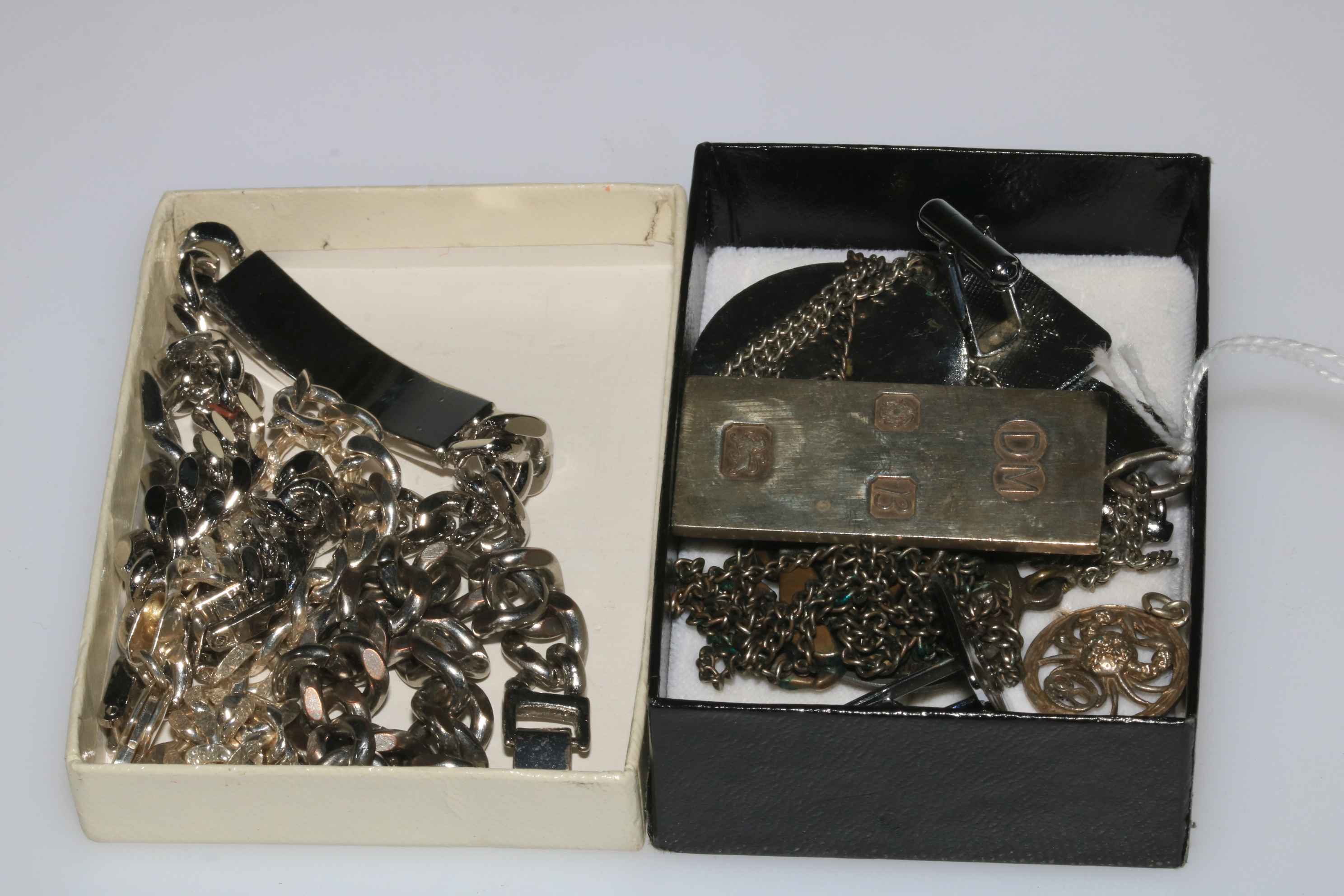 Silver ingot and other jewellery.