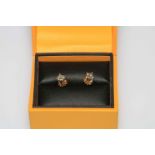 Pair diamond stud earrings in 18 carat gold, total diamond weight approximately 0.7 carat.