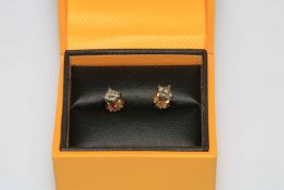 Pair diamond stud earrings in 18 carat gold, total diamond weight approximately 0.7 carat.