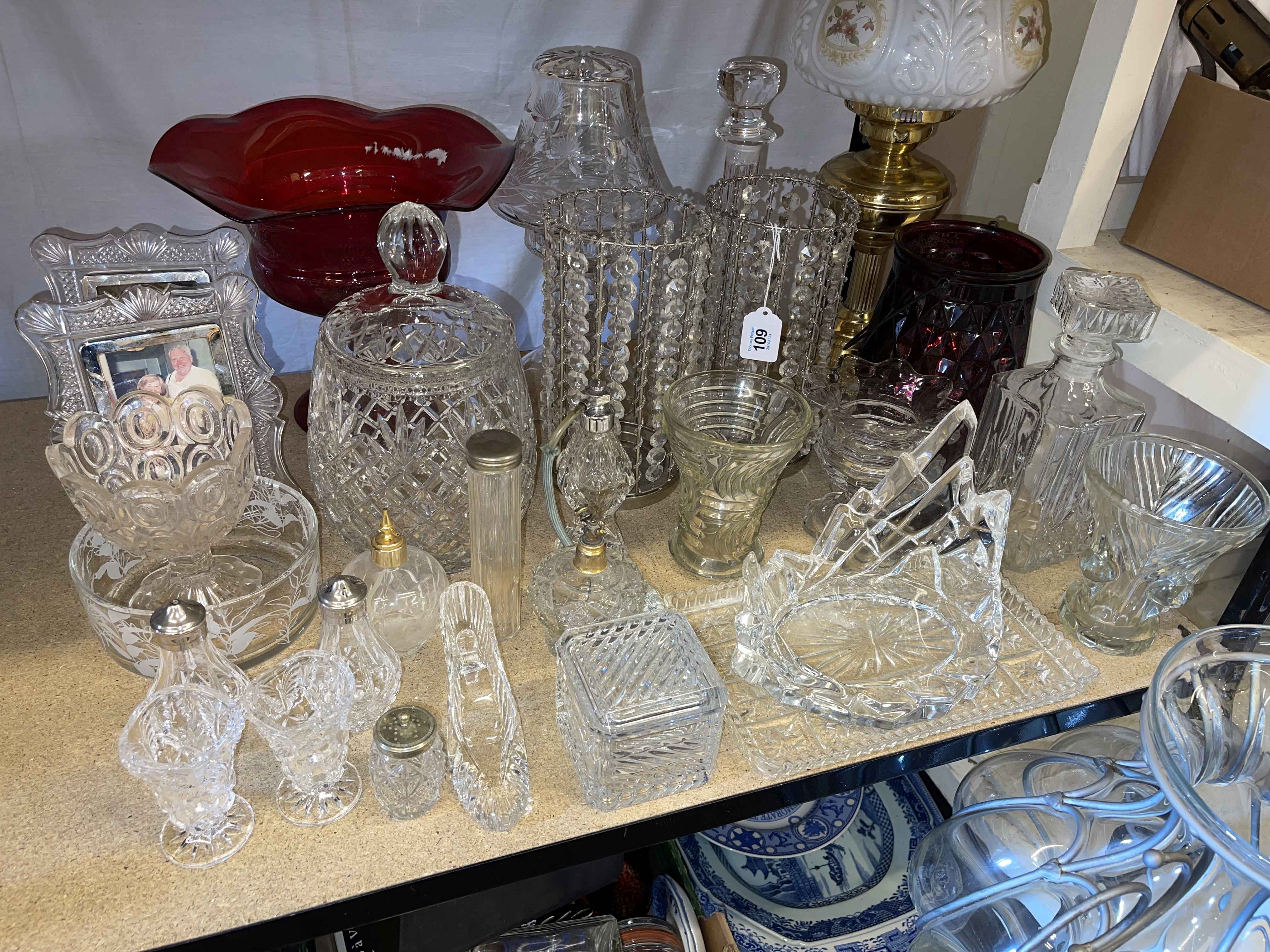 Collection of assorted glass including large vase, two decanters, vases, lamps, photograph frames,