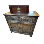 Carved oak two door side cabinet, 86cm by 91cm by 43cm.