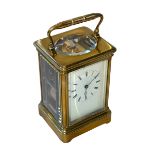 Gilt brass carriage clock with striking movement, 14cm.