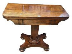 Victorian mahogany fold top card table on octagonal tapering pedestal to quadriform base,