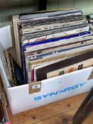 Box of LP's and 45rpm records including Status Quo, Queen, U2 LP's and Style Council,