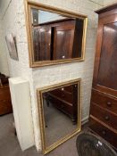 Two gilt framed bevelled wall mirrors, largest 116cm by 90cm including frame.