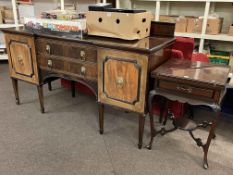 Early 20th Century mahogany inverted breakfront sideboard on eight square tapering legs,