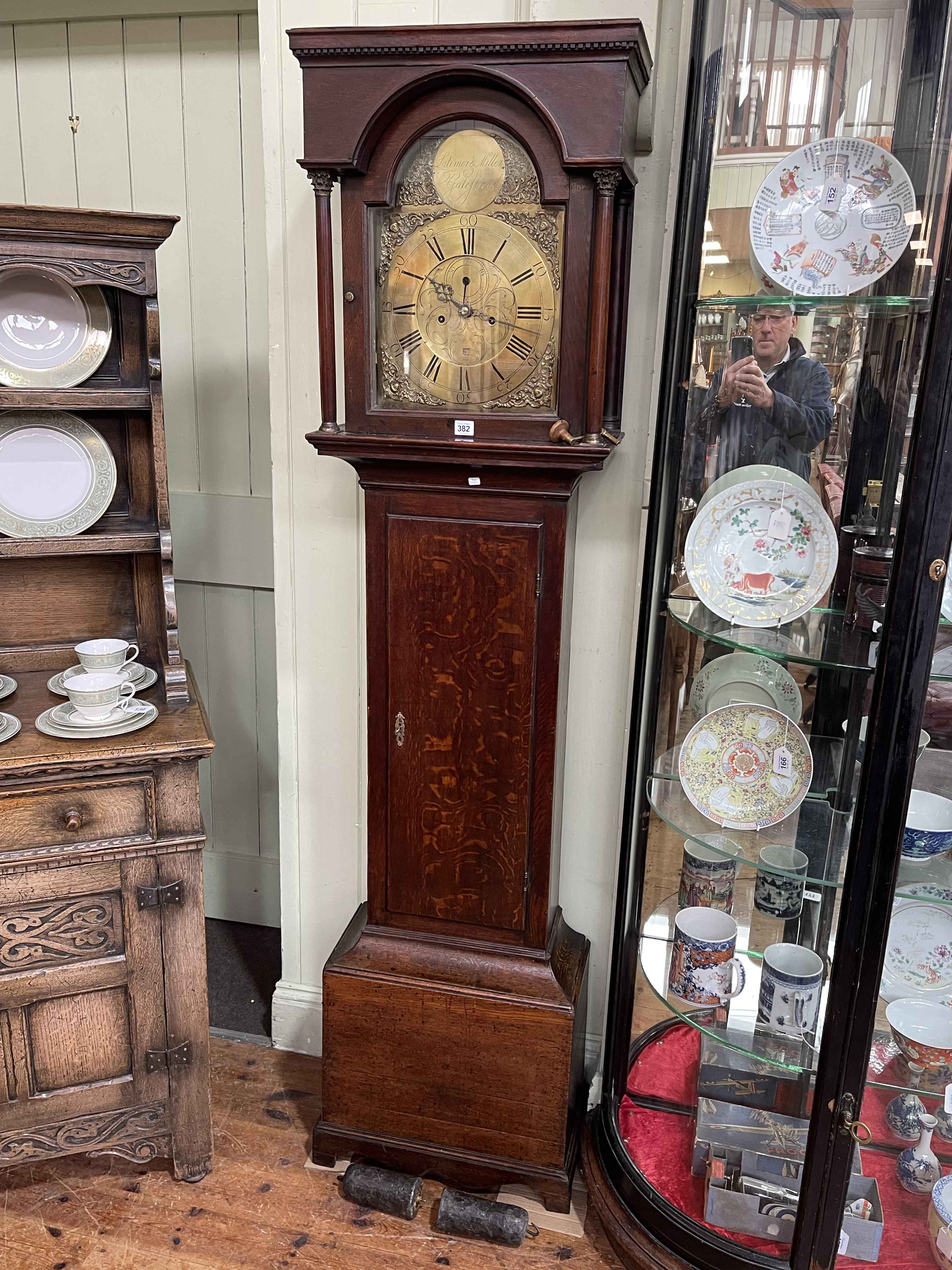 Antique oak cased eight day longcase clock circa 1780 having brass arched dial,