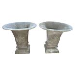 Pair of verdigris effect small cast urns, 26cm high.