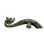 Chinese green jade belt hook in the shape of a dragon, 10cm length.