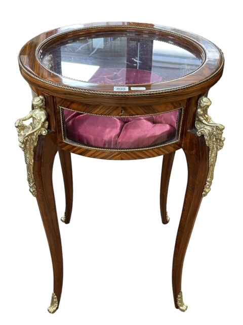 Continental figural mounted circular bijouterie table, 82cm by 54cm diameter.