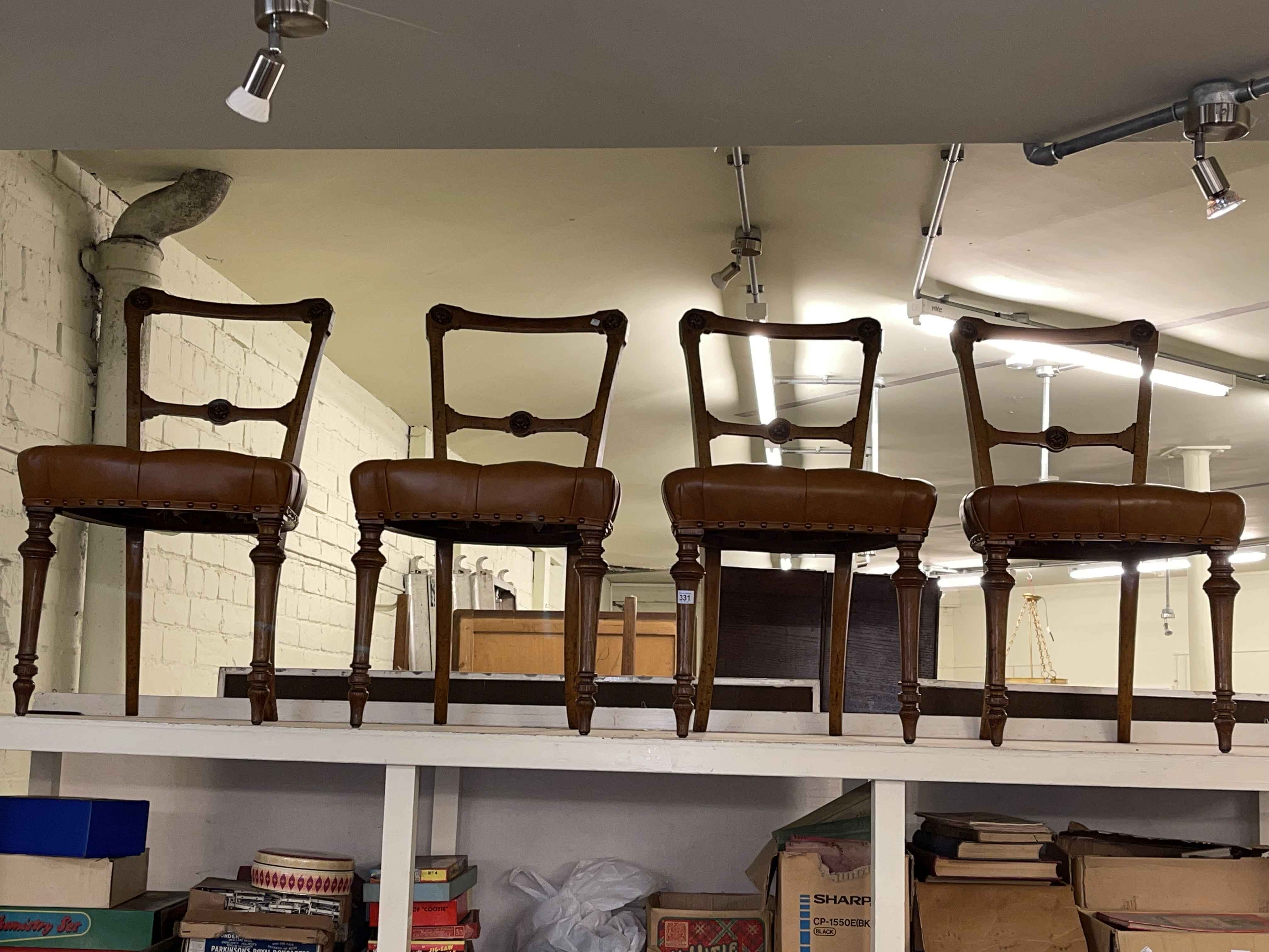 Set of four late Victorian oak dining chairs.