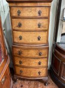 Walnut and mahogany slim bow front chest of six drawers on cabriole legs, 126cm by 52cm by 38cm.