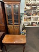 Victorian mahogany glazed panel door top cabinet bookcase and Victorian mahogany fold top tea table