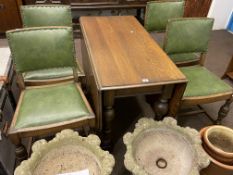 Oak gate leg dining table and four studded hide dining chairs.