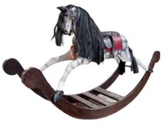 Sponge painted rocking horse with leather saddle, 102cm by 176cm.