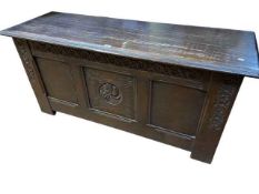 Carved oak triple panel front coffer, 57cm by 123cm by 45cm.