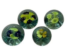 Four glass dump paperweights.