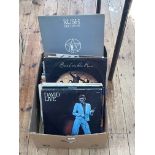 Box of LP and 12inch records, mainly rock and pop.