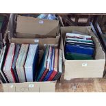 Four boxes of stamp albums, loose stamps, etc.