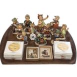 Eleven Hummel figures, six small dishes and two prints.