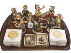 Eleven Hummel figures, six small dishes and two prints.