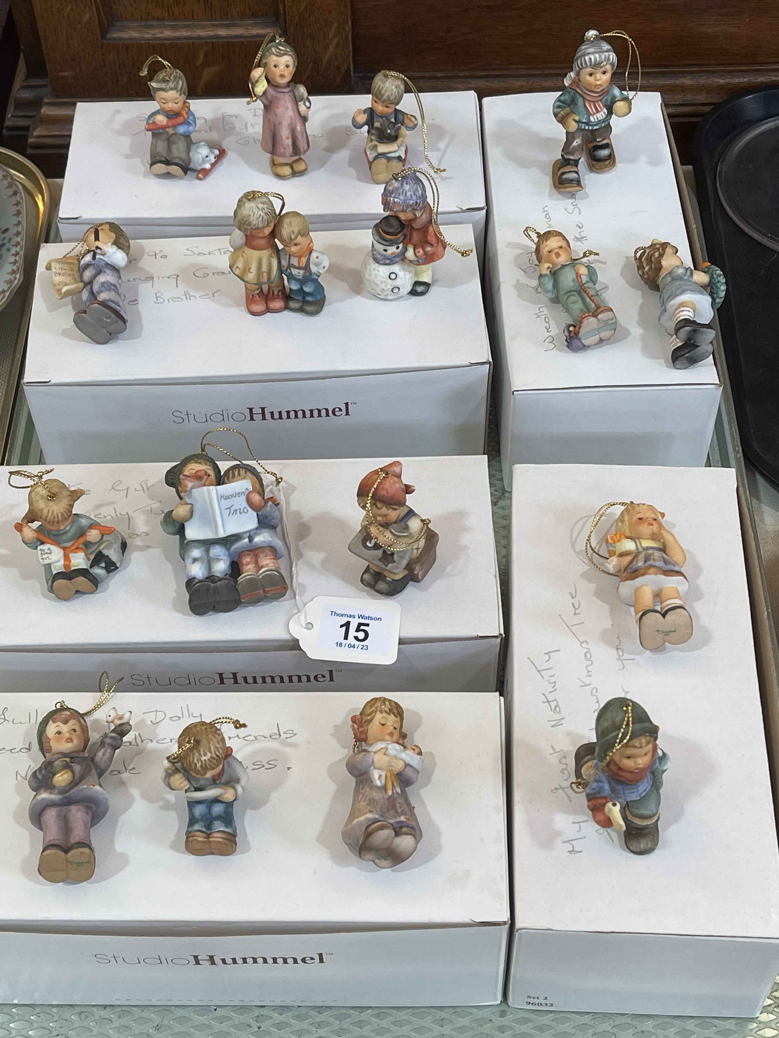 Seventeen Studio Hummel figures.