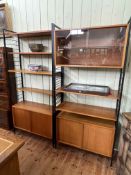 Two vintage teak Staples Ladderax units, one with straight supports and one with angled supports,