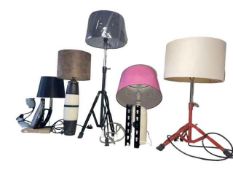 Collection of novelty table lamps and a fan including an iron, ceramic water bottle, tripod base,