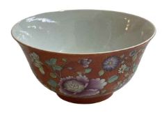 Chinese bowl with floral and famille rose design on orange ground, iron red stamp to base, 13cm.