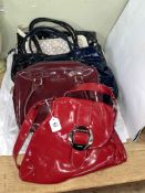 Six ladies handbags marked Lulu Guinness.