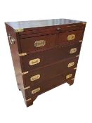 Stained as mahogany Campaign style chest having slide above two short and three long drawers,